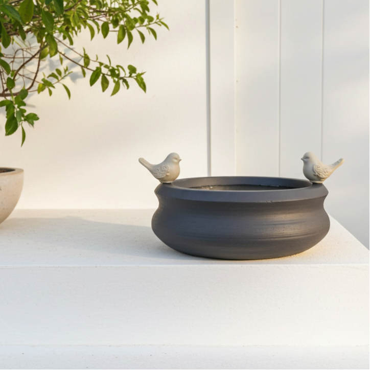 Decorative bird bath with a set of artificial birds